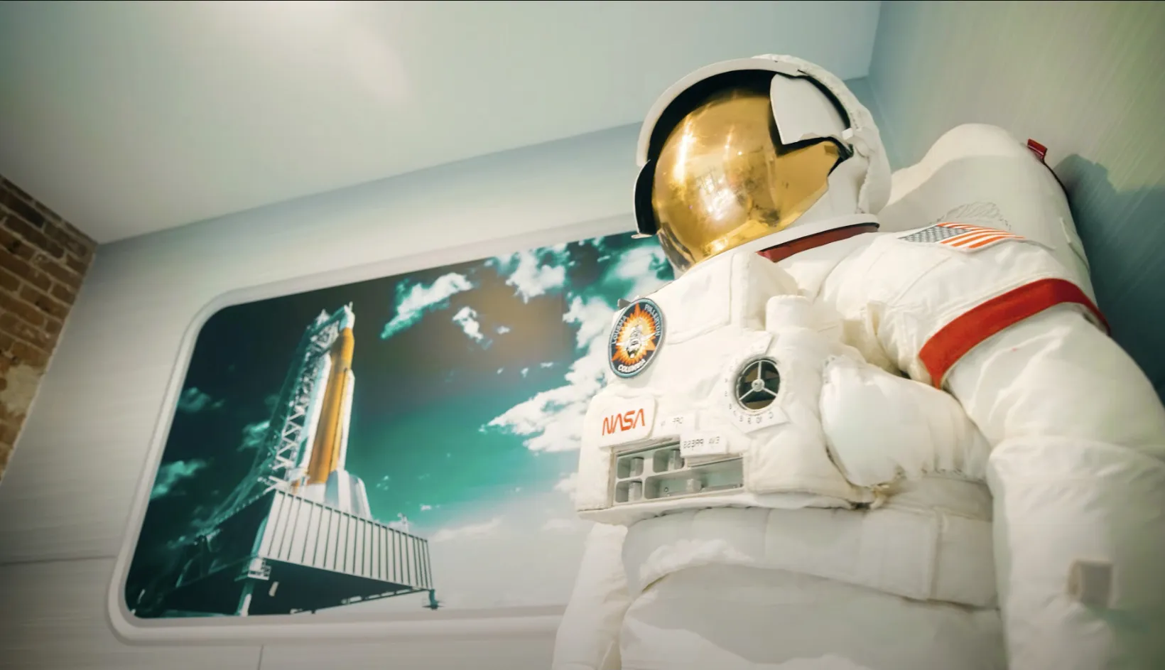 a space suit is displayed in a room