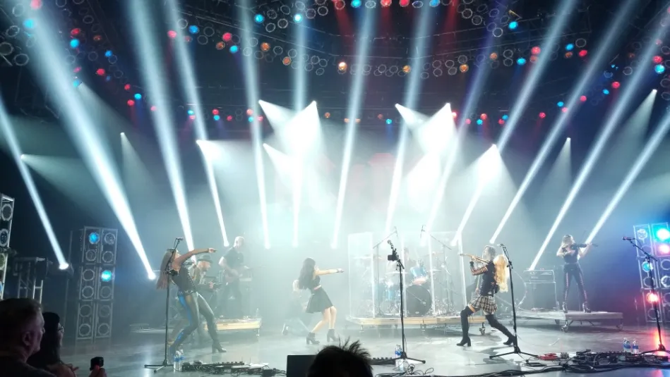 a group of people standing on top of a stage