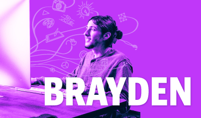 Image of Brayden desigining graphics on a computer