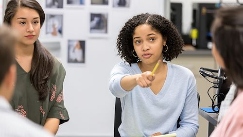 Students having a discussion in a group meeting