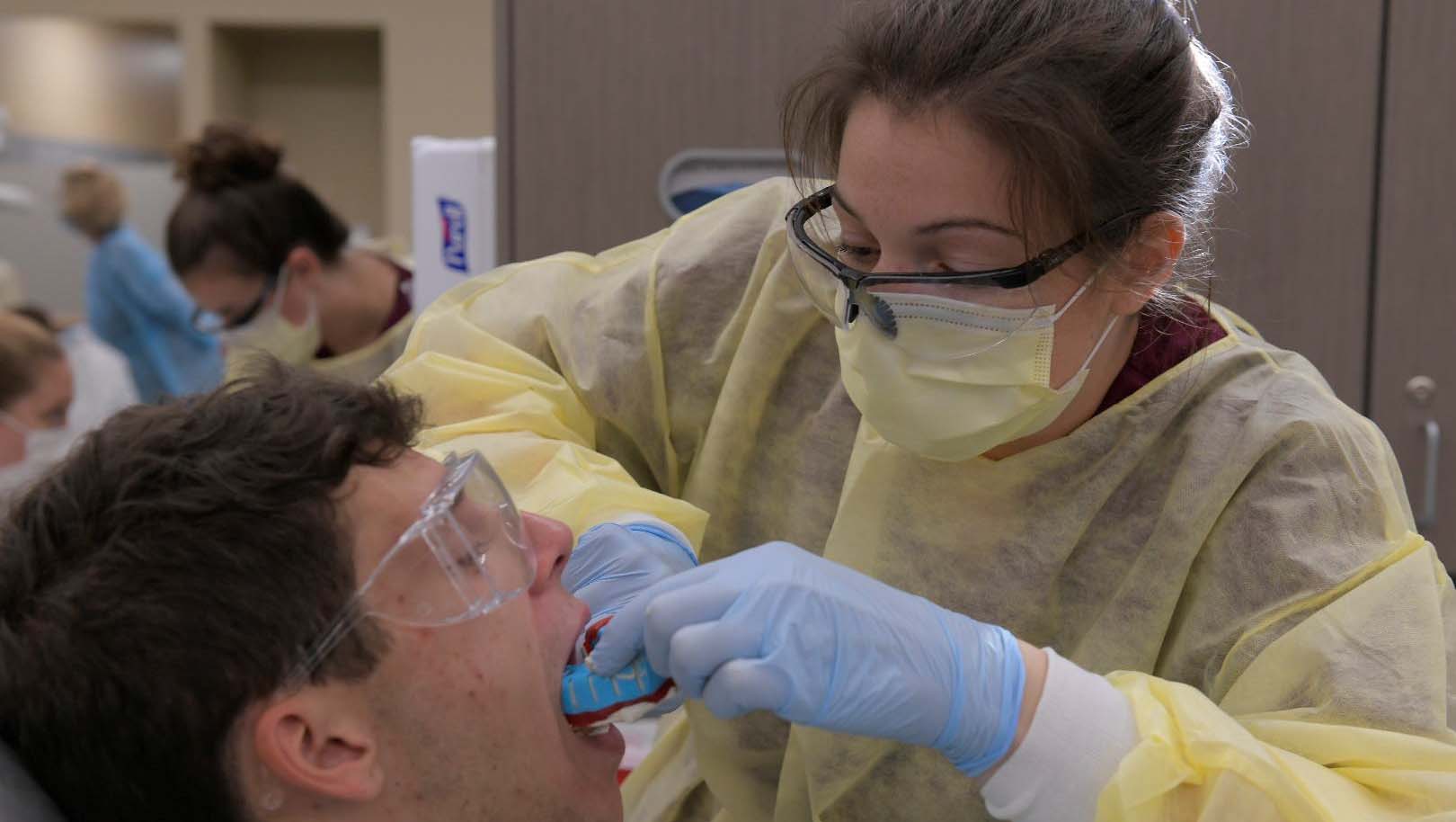 Dental hygiene students create mouth guards for athletes.