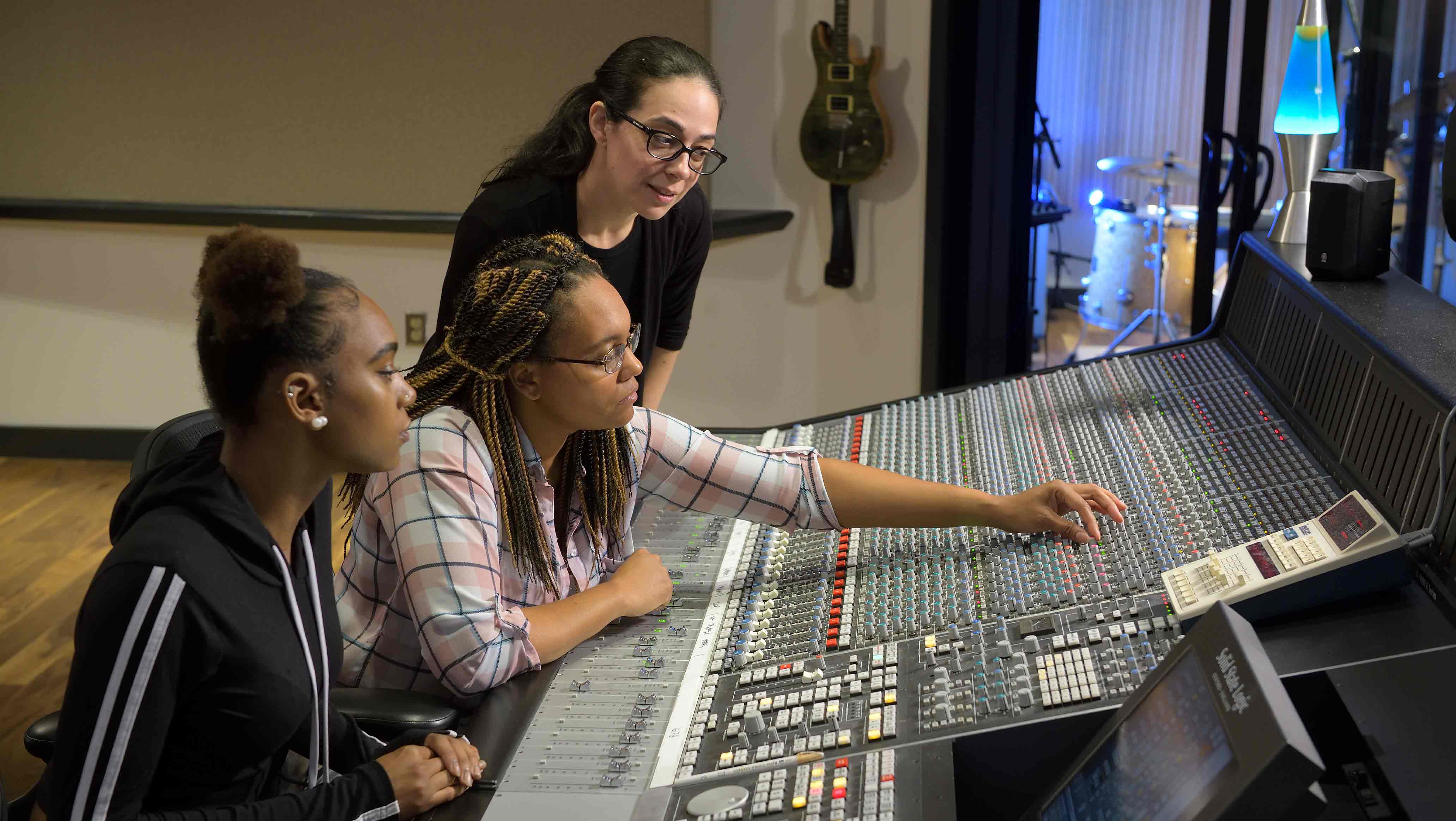 SRT Instructor Jen Mitlas working with students Shea Walker and her daughter Sasha Walker in Montco's new mixing suite. Photo by David DeBalko