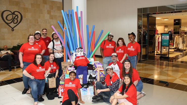 Students of Montco's Theatre Arts program pose with the Iron Throne and "Tippie," both of which they created with donations for the Laurel House Works of heART community project. Photo by Matthew Moorhead