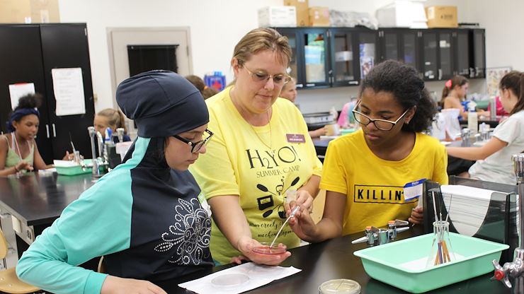 The campers check the results of the cultures of their water samples they took earlier in the week.