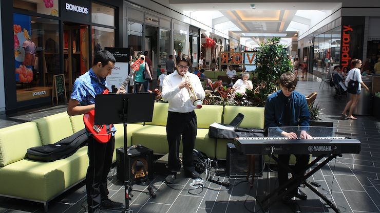 MCCC students Jacob Catania (bass guitar), Matthew Faatz (trumpet) and Trevor Shelly (piano) played jazz standards in the Savor Food Court at the King of Prussia Mall. Photo by Matthew Moorhead