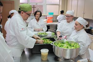CAI students help to prepare food.
