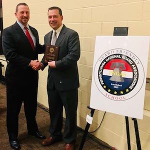 Matt Benko receives PNGAS Guard-Friendly School award