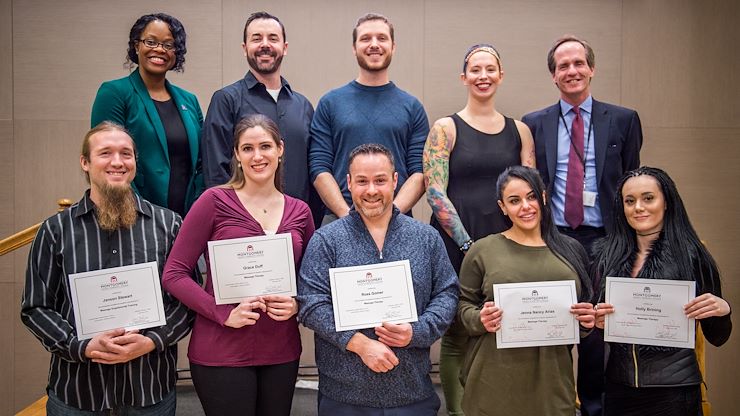 Nine students recently graduated from Montgomery County Community College’s Massage Therapy Program in Blue Bell. Front row, from left: Janson Stewart, Grace Duff, Ross Gomer, Jenna Nancy Arias and Holly Brining (missing Laura M. Helouvry, Julian L. Joseph, Zoe Rodriguez and Anthony Serpiello). Back row, from left: MCCC Interim Vice President of Academic Affairs Dr. Gloria Oikelome; Massage Therapy Program Director William Mullen, LMT; Anatomy & Physiology Instructor Jason DiCola, LMT; Massage Therapy Instructor Lara Brusch, LMT; and Executive Director of Workforce Development Gregory Skelley. Photo by Chloe Elmer