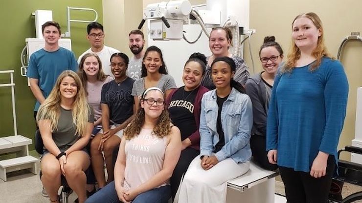 Students in the Radiography Class of 2020 donated $400 they fundraised for their pinning ceremony to help their peers. Back row, from left: Benjamin Manning, James Oh, Christopher Tatam, Morgan Kerper, Julianne Knight and Samantha Baker. Middle row, from left: Jessica Spano, Jenna Fritz, Kylah Venable, Jade Rodriguez, Loriel Outterbridge. Front row, sitting: Marlena Mercado.
