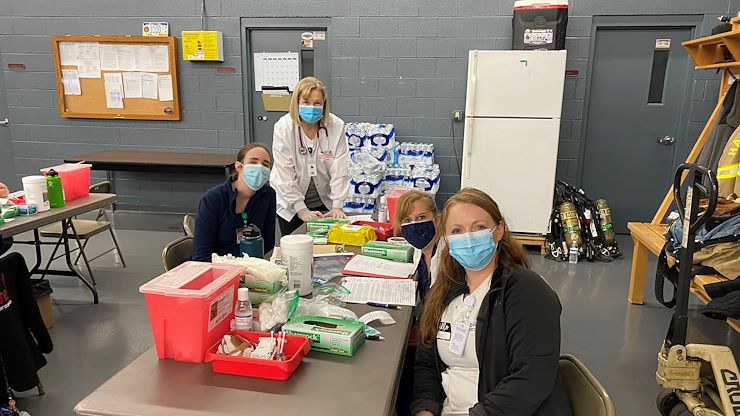 Senior Lecturer Gretchen White, Lecturer Stephanie Plunkett and students Cathy Nanovic and Piper Stacks are among the 35 students and 15 faculty from the Nursing program, who have volunteered to administer COVID-19 vaccines throughout the community this month.