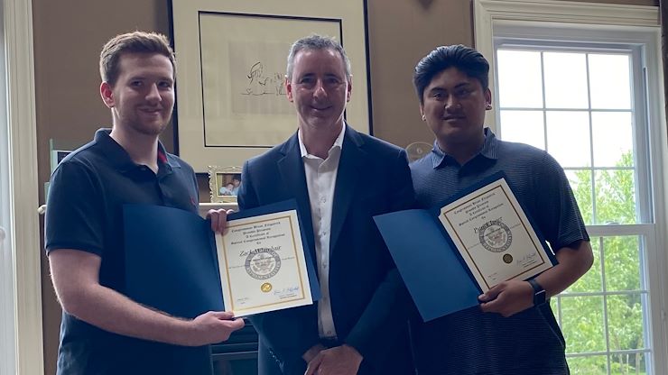 Congressman Brian Fitzpatrick (center) recently recognized 15 student volunteers who helped the Boston Legacy Foundation get national attention for the contributions of the late Dr. Frank Erdman Boston. Montgomery County Community College students Zack Whitehair (left) and Patrick Javier (right) were among the volunteers who worked on the project.