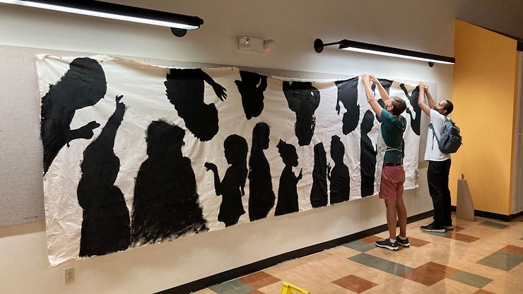 A new mural created by campers in the "Amazing Arts Race" summer camp this year has been put on display inside Minerva D. Braemer Medical Arts Building. The mural depicts the silhouettes of each camper.