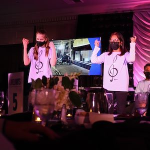 Students use sign language during their performance.