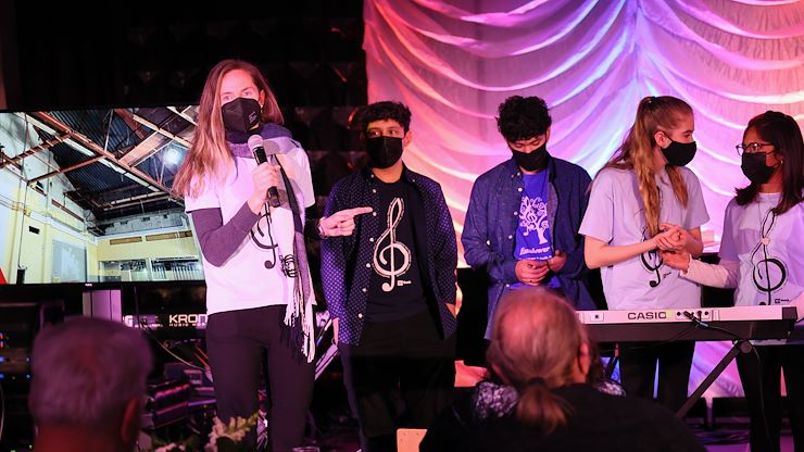 Dr. Barbara Weikert, Music and Choral Director, and her students at Eisenhower Science and Technology Leadership Academy, speak to the audience as they help kick off the Lively Arts Series season featuring jazz vocal group "Manhattan Transfer." Photos by Lou Liguori.