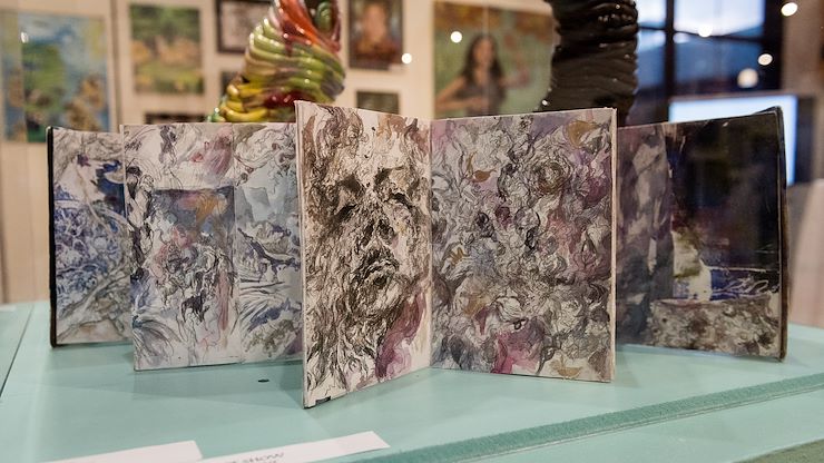 Two-hundred eighty-seven students from 24 local high schools are participating in the 35th Annual 'Reach for the Future' art exhibit at Montgomery County Community College's Fine Arts Gallery on the Blue Bell Campus. Rowan Blankemeyer of Upper Dublin High School won First Place Best of Show for his Jelly Print Book.