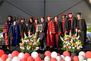 Dr. Kendall Martin with the President, members of the Cabinet and the Board of Trustees.