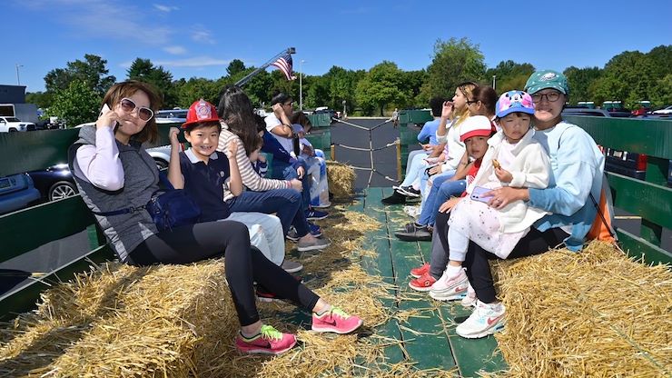Families enjoyed activities such as the hayride at the annual Whitpain Community Festival held at Montgomery County Community College's Blue Bell Campus. Photo by David DeBalko