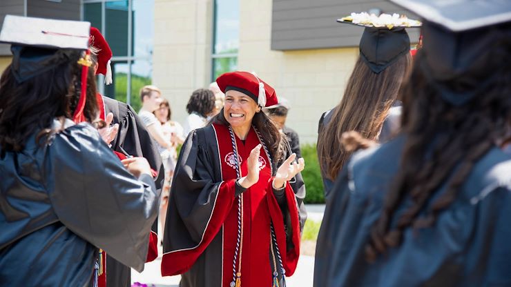 MCCC Board of Trustees Chair Varsovia Fernandez applauds graduates