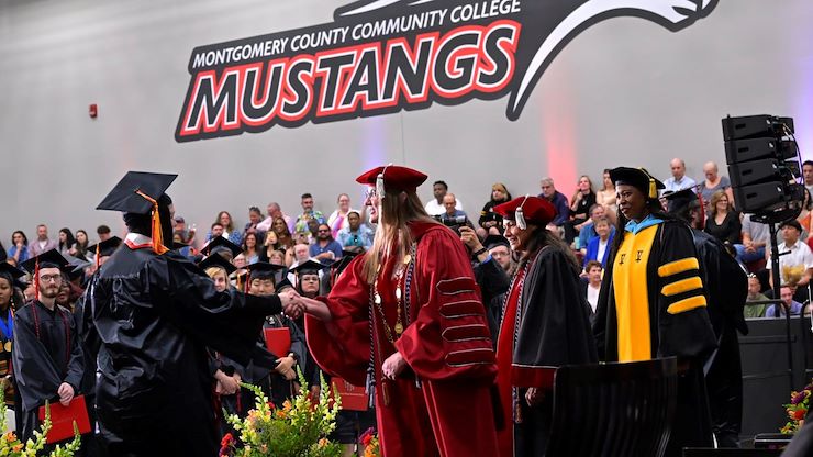 Montgomery County Community College celebrated the accomplishments of the 1,287 graduates during three Commencement ceremonies. Dr. Victoria Bastecki-Perez, MCCC President; Varsovia Fernandez, MCCC Board of Trustees Chair; and Dr. Chae Sweet, Vice President for Academic Affairs, congratulate each graduate as they walk across the stage. Photos by David DeBalko and Linda Johnson