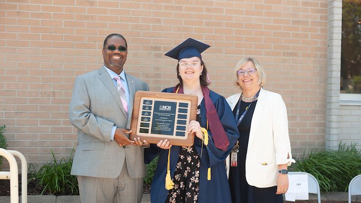 Dr. Samuel Coleman, MCCC Dean of Students, stands with The Andreson School Principal Christine Raber and graduate Victoria Mauger at the school's graduation ceremony. Mauger received the Montgomery County Community College Full-Tuition Scholarship. Photo courtesy of Dr. Samuel Coleman.