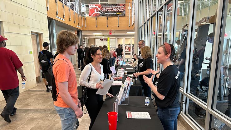 A volunteer answers questions from a prospective student and family member during the spring open house in the Health Sciences Center on Blue Bell Campus. The fall open house at Blue Bell Campus will be held Saturday, Oct. 21. Photo by Eric Devlin