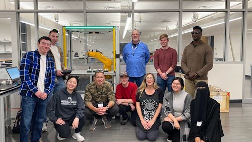 Students collaborate to address a real-world automation issue