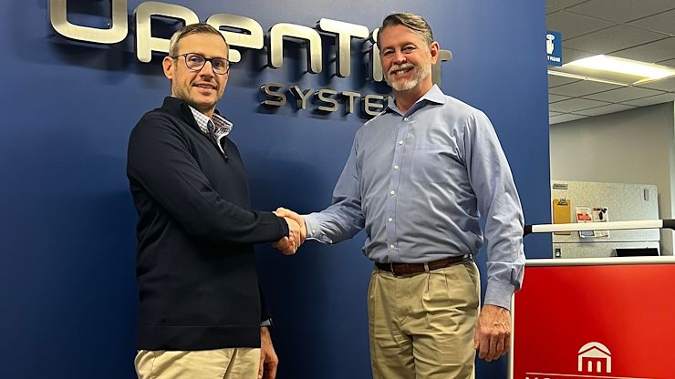 Brian McCarthy Jr., President/Partner, Open Tier Systems of Blue Bell (left) shakes hands with Lawrence Byron, Montgomery County Community College Director of Workforce Development for Information Technology. Open Tier and the Montgomery County Intermediate Unit-Office of Technology Services of Norristown (not pictured) are collaborating with MCCC as part of the launch of the new MontcoWorks Apprenticeship Program for Information Technology. Photo by Christine Stenner