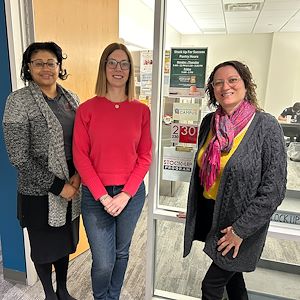 Nichole Kang, Karima Roepel and Jennifer Fanega outside the Stock Up for Success food pantry