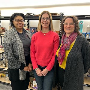 Karima Roepel, Nichole Kang and Jennifer Fanega in the Stock Up for Success food pantry