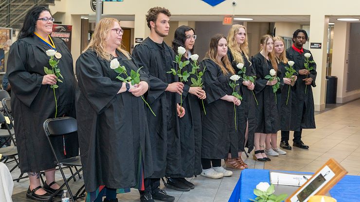 inductees receive symbolic white roses