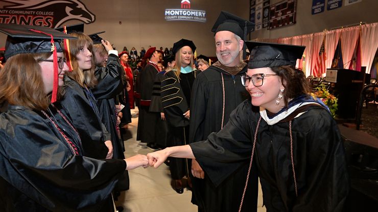fist-bumping faculty