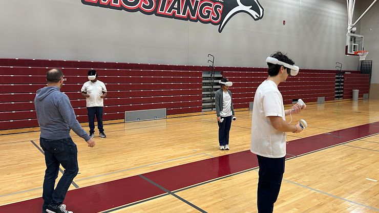 Matthew Kilbride, Montgomery County Community College Academic Technologies Innovation Specialist oversees Nursing students Jonathan April, Silvia Gonzalez and Eric Nazario as they wear virtual reality headsets to evaluate a simulated patient suffering from a heart attack. Photo by Eric Devlin