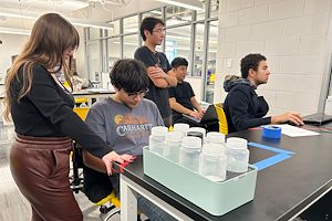 STEM students program a Kuka robotic arm during the Merck & Co. Automation and Innovation Challenge