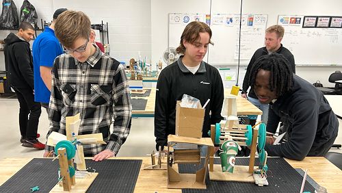 Pottstown School District alumni and Leigh University engineering students Austin Sundstrom, Regina Fleming and Mehki Jenkins-Glover evaluate Montco 360 STEM program student projects at Montgomery County Community College’s Pottstown Campus.