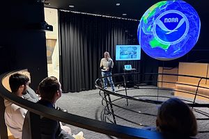 Montgomery County Community College Communications Studies 110 student  Wynter Liebel presents research from NOAA during an informational speech using the Science on a Sphere® on the Pottstown Campus. 