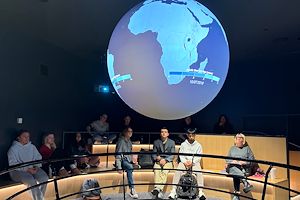 Students in the Communications 110 course at Montgomery County Community College watch a presentation displayed on the Science on a Sphere® in the lobby of South Hall on the Pottstown Campus. 