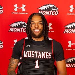 Matthew Williams portrait in front of a red Monto background