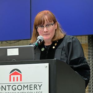 Dr. Catherine Parzynski speaks during a Phi Theta Kappa induction ceremony