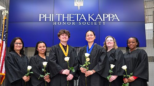 Students inducted into Phi Theta Kappa wearing black robes and medallions. Montgomery County Community College’s Alpha Kappa Zeta chapter of Phi Theta Kappa was named a 2025 REACH chapter. Photo by Dave DeBalko
