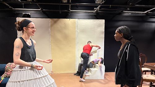 Student performers Hannah Redding-Gurczynski, Steve Belskie, Mya Smith and Medhin El rehearse a scene from “Fairview