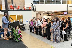 New members of Montgomery County Community College’s Beta Alpha Chapter of Alpha Alpha Alpha National Honor Society for first generation college students stand during an induction ceremony on the Blue Bell Campus. 
