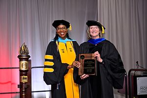 Dr. Chae Sweet, Vice President of Academic and Student Affairs and Provost, stands with Dr. Margaret Bryans, Professor of Biology and Biotechnology Program Coordinator, as she gives her the 2026 Lindback Distinguished Teaching Award