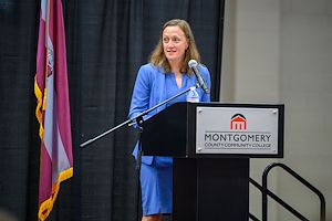 Montgomery County Deputy District Attorney Kelly Lloyd speaks at a lectern at the Municipal Police Academy graduation ceremony