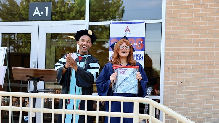 Dr. Michael Harcum, Montgomery County Community College Director of Admissions, stands with Kylie Eickhoff, the recipient The Montgomery County Community College Full Tuition Scholarship during The Anderson School graduation ceremony. Photo by Jared Rohlfing