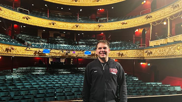Christopher Palmer stands on stage in the Theatre Royal in Glasgow, Scotland during a touring production of "School of Rock." He credits his time at Montgomery County Community College for helping him start on the path to a successful acting career. Photo courtesy of Christopher Palmer.