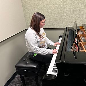 Kayla Horger playing piano