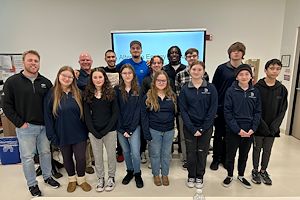 Aaron Laws stands with a group of students and faculty in the Montco 360 program