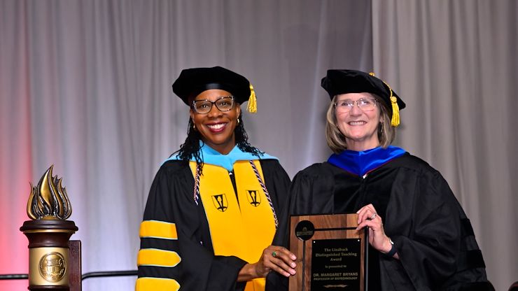 Dr. Chae Sweet, Vice President of Academic and Student Affairs & Provost at Montgomery County Community College, presented the 2026 Lindback Distinguished Teaching Award to Dr. Margaret Bryans, Professor of Biology and Biotechnology Program Coordinator, during the College’s 59th Commencement May 14. Photo by David DeBalko